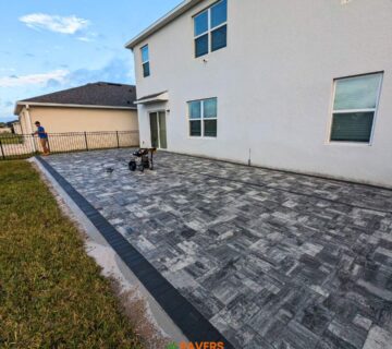 Backyard and sidewalks with white charcoal pavers