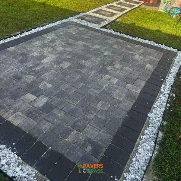 Design of a backyard prepared for a pergola’s installation Paversngrass