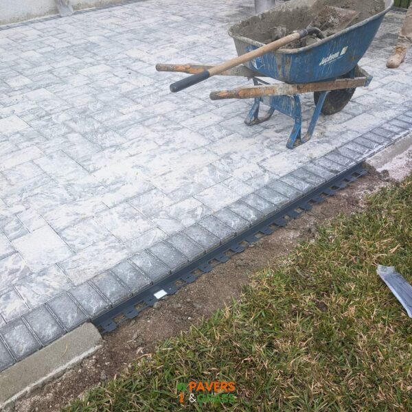 Backyard and sidewalks with white charcoal pavers