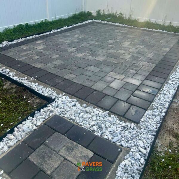 Design of a backyard prepared for a pergola’s installation Paversngrass