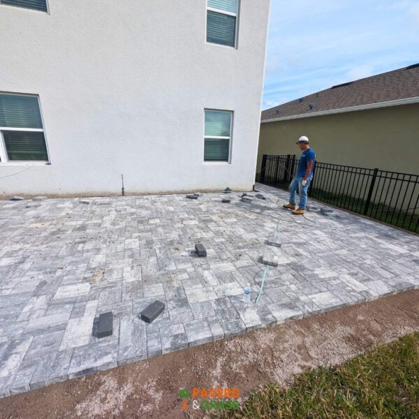 Backyard and sidewalks with white charcoal pavers