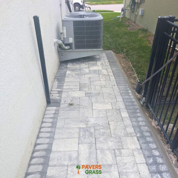 Backyard and sidewalks with white charcoal pavers