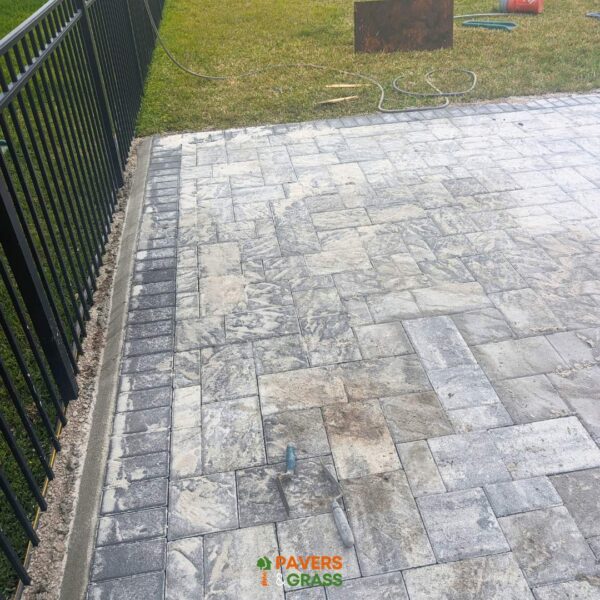 Backyard and sidewalks with white charcoal pavers