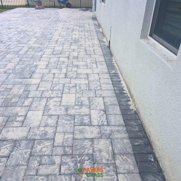Backyard and sidewalks with white charcoal pavers