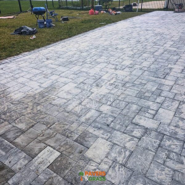 Backyard and sidewalks with white charcoal pavers