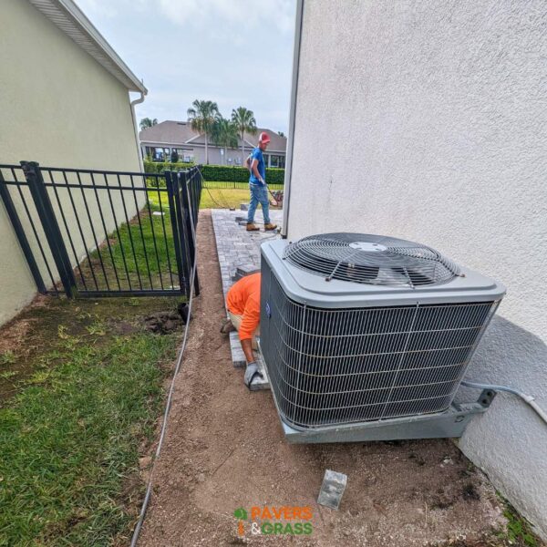 Backyard and sidewalks with white charcoal pavers