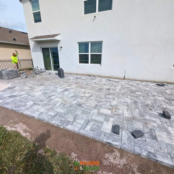 Backyard and sidewalks with white charcoal pavers